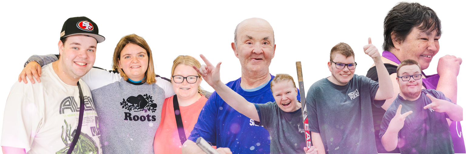 A group of happy people smiling with arms around friends, hockey sticks or waving their arms
